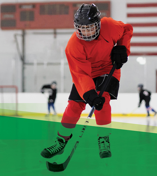 A teen playing hockey.